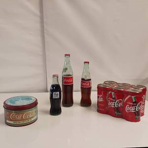 lot 37 image: Coca-Cola Tins and Full bottles, Unique 6 pack tin & 50th anniversary South Dakota, Crazy Horse Memorial bottle