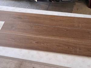 lot 318 image: Lot of (65 Boxes) 1541-sq.ft. LVP Waterproof Rigid Core Luxury Vinyl Click Plank Flooring with Pad 5mmx7.15x47.75  23.71-sq.ft. GEN4128RIG 10-count ( 650 total items ) (Amber)