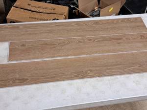 lot 328 image: Lot of (50 Boxes) 1185-sq.ft. LVP Waterproof Rigid Core Luxury Vinyl Click Plank Flooring with Pad 5mmx7.15x47.75  23.71-sq.ft. GEN4129RIG 10-count ( 500 total items ) (Ale)