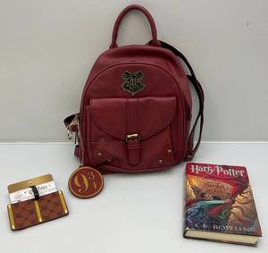 lot 81 image: Harry Potter Backpack, Luggage Tag & Harry Potter And The Chamber Of Secrets Book