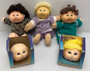 lot 113 image: Misc. Vintage Cabbage Patch Dolls & Heads With Original Boxes