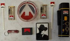 A Unique Assortment of Marlboro Cigarette Collectibles (1) Flashlight/ AM/ FM Radio (1) Pocket Knife Key Chain (1) Deck of Cards (2) Lighters (1) Ashtray (1) Box of Matches (2) Plastic Stir Sticks (View / Photos)