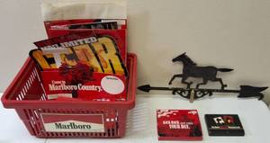 lot 16 image: Malboro Cigarette Collectibles - (1) Marlboro Wild West Playing Cards - 2 Pack, (1) Ashtray, Assortment of Marlboro Cigarettes Advertisement Materials & (1) Horse Weathervane (View Photos)