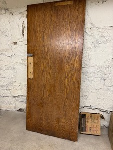 lot 106 image: Solid Wood Door and Box of Commercial Vinyl Tile