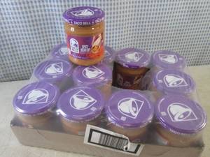 lot 225 image: (B-2) 12 Jars of Taco Bell Spicy Be...