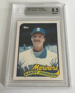 lot 8 image: Randy Johnson RC Beckett 8.5 NM-MT 1989 Topps Traded #57T Rookie Baseball Card