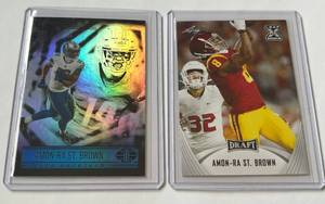 lot 133 image: Amon-Ra St. Brown 2 RC Lot Football Rookie Cards