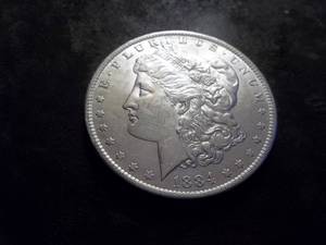 lot 14 image: 1884 O Morgan Silver Dollar
