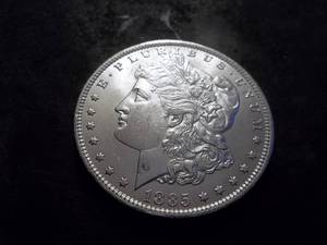 lot 15 image: 1885 O Morgan Silver Dollar