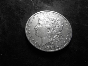 lot 18 image: 1886 O Morgan Silver Dollar