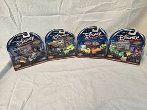 lot 97 image: (4) Disney Wild Racers Collectables