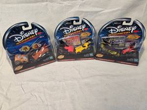 lot 98 image: (3) Disney Wild Racers Collectables