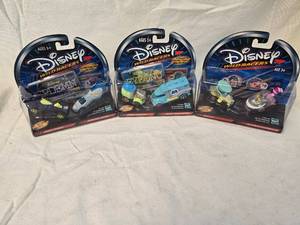 lot 99 image: (3) Disney Wild Racers Collectables