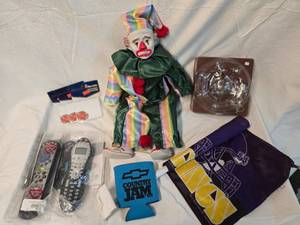 lot 251 image: Misc. Items, Clown Doll, Christmas Ornament, Vikings Flag, Universal Remotes