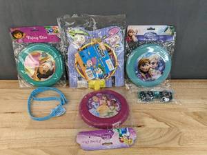 lot 83F image: New Disney and Nickelodeon Kids Toys Dora the Explorer, Disney Princesses, and Frozen Flying Discs, Kid Sunglasses, The Fairly Odd Parents Waste Basket Backboard, and Blue Silicone Lanyard N