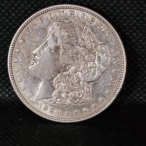 lot 67 image: 1921 Toned Morgan Silver Dollar