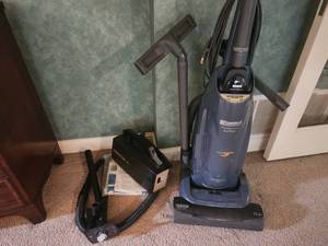 lot 24 image: Two Vacuums - Kenmore Progressive Upright Vacuum Cleaner and Oreck Hand Held Vacuum