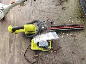 lot 67 image: Ryobi Cordless Hedge Trimmer 18V with Battery and Charger