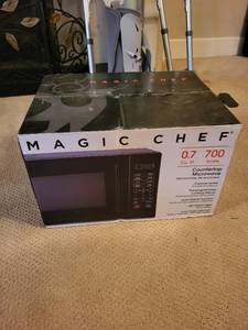 lot 113 image: Never Used Magic Chef 0.7 Cu. Ft. Countertop Microwave with Digital Display - New in Box