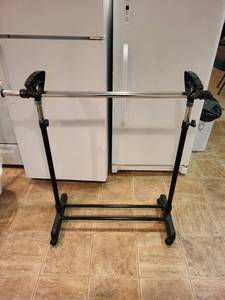 lot 135 image: Adjustable Height Clothing Rack with Heavy Duty Base