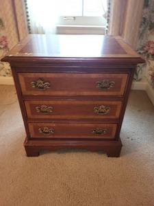 lot 231 image: Vintage Wooden Three-Drawer Nightstand with Brass Handles