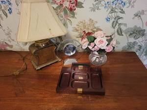 lot 237 image: Mixed Collectible Set Vintage Table Lamp, Glass Clock, Wooden Desk Organizer, and Faux Floral Arrangement