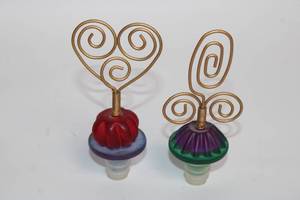lot 2 image: Pair of Decorative Wine Bottle Stoppers with Wire Art