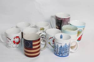 lot 13 image: Collection of 11 Assorted Ceramic Coffee Mugs with Various Designs