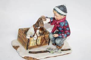 lot 21 image: Norman Rockwell Porcelain Figurine A Boy Meets His Dog First Edition