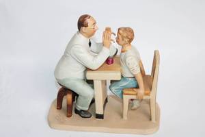 lot 22 image: Norman Rockwell Ceramic Figurine of Doctor and Boy