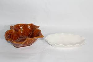 lot 97 image: Set of 2 Decorative Bowls - White Porcelain and Leaf-Shaped Glazed Ceramic