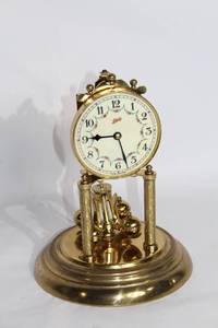 lot 105 image: Vintage Brass Anniversary Clock by Lacey with Floral Dial