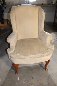 lot 152 image: Vintage Beige Wingback Armchair with Wooden Legs