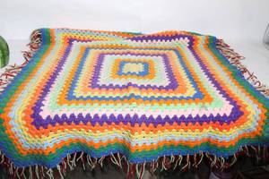 lot 186 image: Colorful Handmade Crochet Blanket with Fringe Accents
