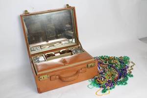 lot 255 image: Vintage Leather Makeup Case with Assorted Mardi Gras Beads