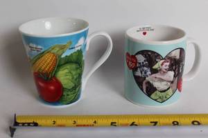 lot 442 image: Set of 2 Ceramic Mugs Burpee 125th Anniversary & I Love Lucy 50th Anniversary