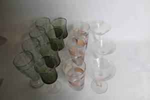 lot 456 image: Mixed Glassware Collection with Vases, Pint Glasses, and Cocktail Glasses