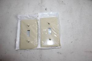 lot 441 image: Box of Bulk Light Switch Cover Plates in Cream Color