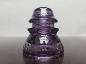 lot 263 image: Beautiful Antique Whitall-Tatum AmethystPurple Embossed Glass Insulator 
