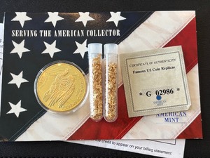lot 119 image: Replica Gold Layered St. Gaudens Coin and Tubes of Gold Flakes