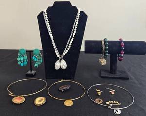 lot 11 image: Collection of Costume Jewelry Featuring Necklaces, Bracelets, Earrings, and Bangles - display not inc