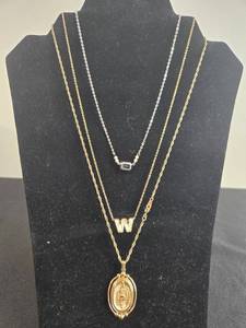 lot 50 image: Collection of Gold Tone and Silver Tone Necklaces with Pendants - display not inc