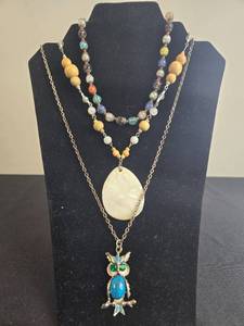 lot 64 image: Set of Jewelry with Gemstone Owl Necklace, Beaded Necklace, and Gold-Toned Bracelet - display not inc