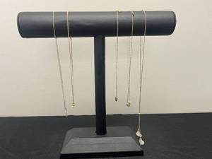 lot 115 image: Collection of Gold Tone Necklaces by Avon - display not inc