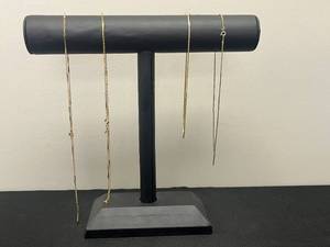 lot 117 image: Collection of Gold Tone and Mixed Metal Necklaces - display not inc