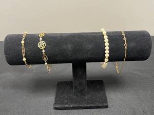 lot 119 image: Set of Gold Tone and Pearl Bracelets with Unique Designs - display not inc