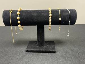 lot 121 image: Set of Mixed Metal Bracelets with Pearl Like and Oval Designs - display not inc