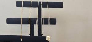 lot 98 image: Collection of Gold-Tone Finish Necklaces with Various Pendants - display not inc