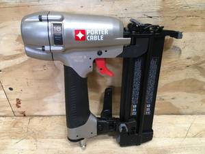 lot 27 image: Porter-Cable 18-Gauge Pneumatic Brad Nailer Kit Model # BN200C