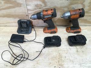 lot 35 image: RIDGID 18V Cordless 12 in. DrillDriver & 18V Cordless 14 in. Impact Driver with (2) 2Ah Batteries and Charger
